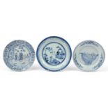 Three Chinese blue and white porcelain plates hand painted with figures and pagodas, the largest