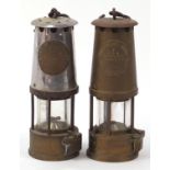 Two miner's lamps, one with chrome top, the other with engraved inscription around the side, 24cm