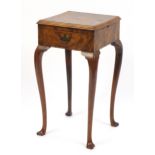 Burr walnut side table with frieze drawer and side brushing slide, raised on cabriole legs, 75cm H x
