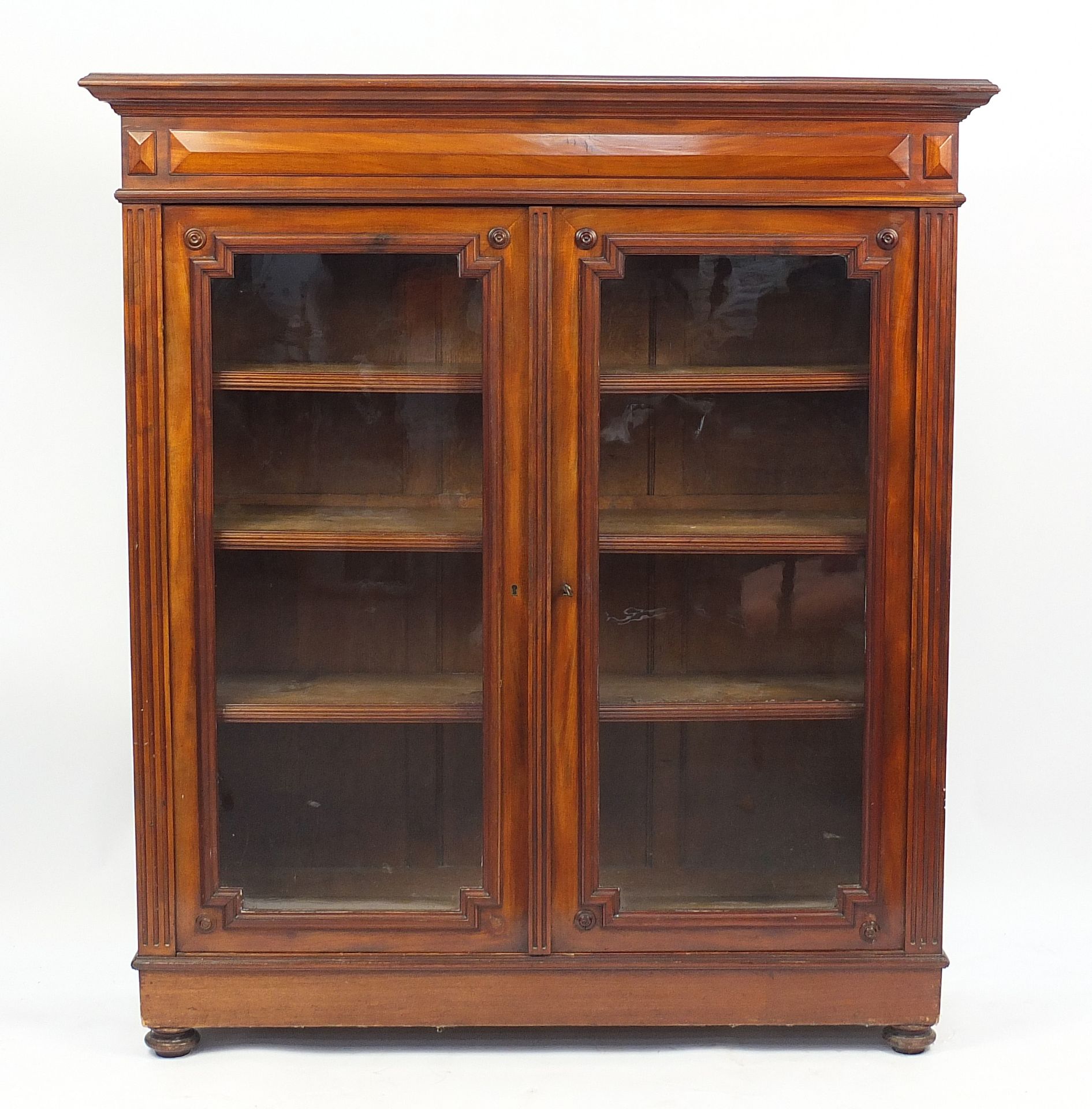 Mahogany bookcase fitted with a pair of glazed doors enclosing three adjustable shelves, 169cm H x