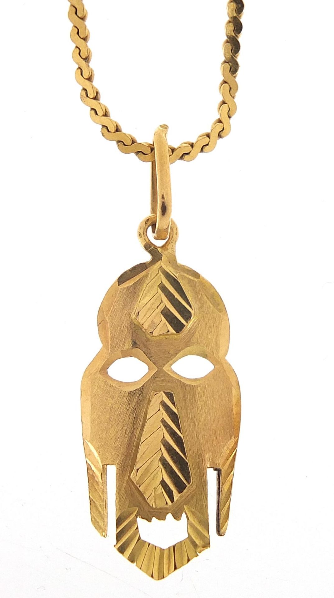 18ct gold tribal mask pendant on an 18ct gold necklace, 3cm high and 48cm in length, 6.0g