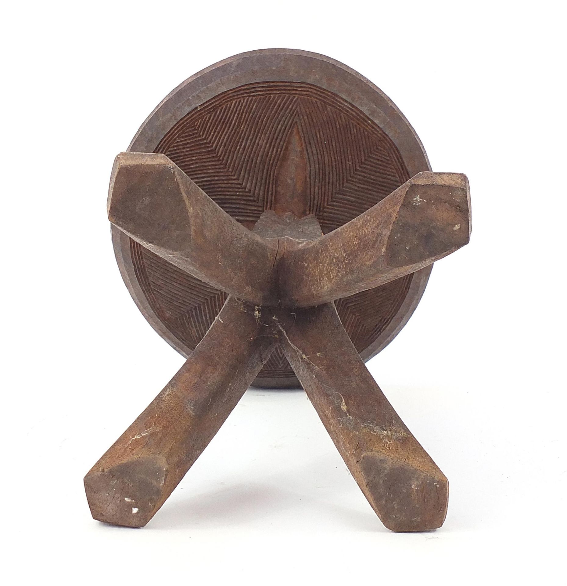 African tribal interest carved stool, 34cm high x 31cm in diameter - Image 4 of 4