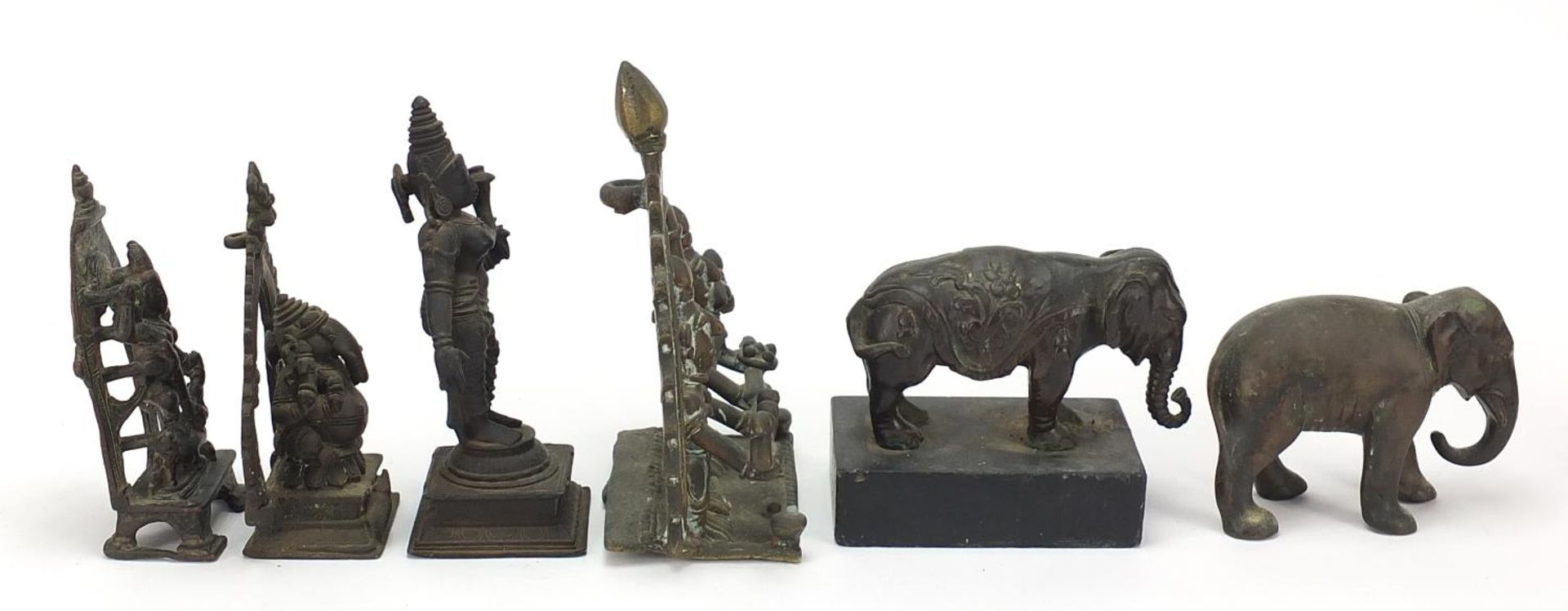 Indian bronzes including votive figures and two elephants, one raised on a rectangular black slate - Image 7 of 9