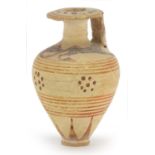 Proto-Corinthian elongated aryballos with lip and single handle, hand painted with two animals on