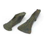 Two antique patinated bronze axe heads, the largest 16cm in length