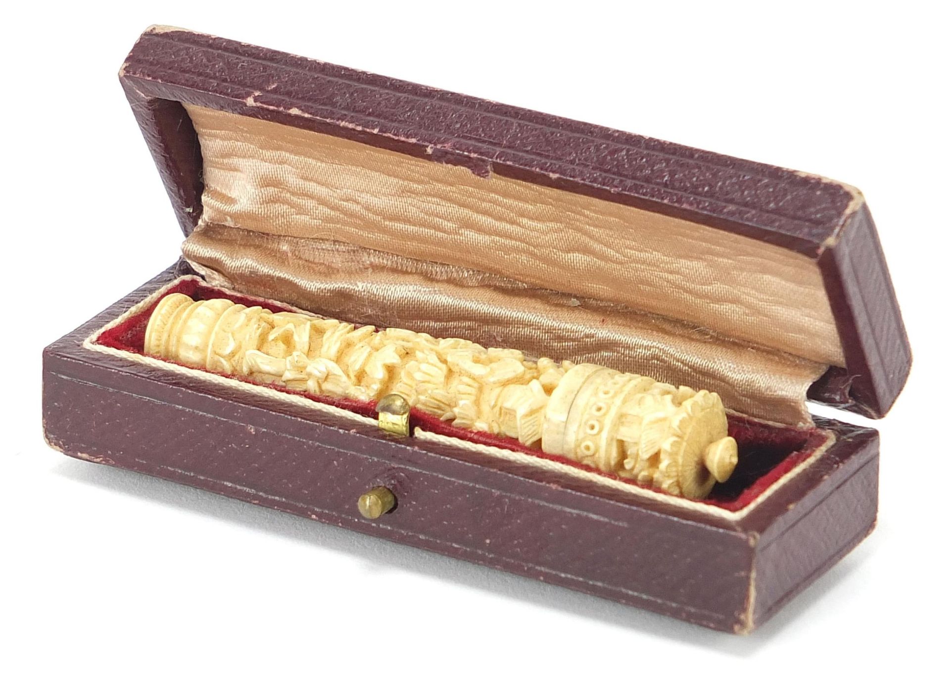 Chinese carved ivory needle case carved with figures amongst foliage and trees, housed in a - Image 7 of 9