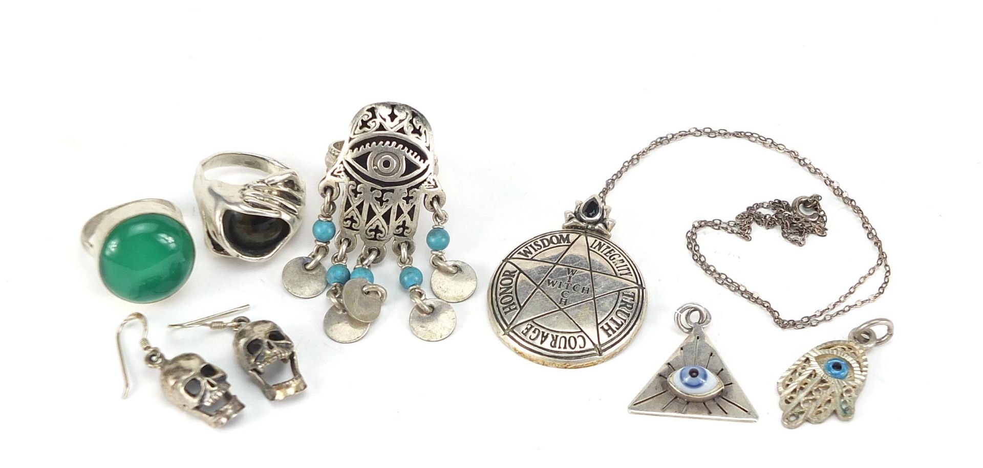 Silver jewellery including human skull design earrings, all seeing eye ring and pendant and a