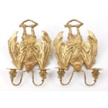 Pair of Art Nouveau style patinated bronze two branch bat design wall sconces, each 36cm high