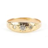 18ct gold diamond three stone Gypsy ring, size P, 2.0g