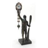 Patinated bronze military interest mystery clock in the form of a pilot, 37cm high