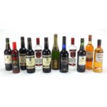 Twelve bottles of alcohol including Smirnoff vodka, sherry, Champagne, Southern Comfort and Harvey's