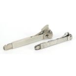 Two Victorian and later silver cigar cutters, London 1896 and 1978, the largest 15cm in length,