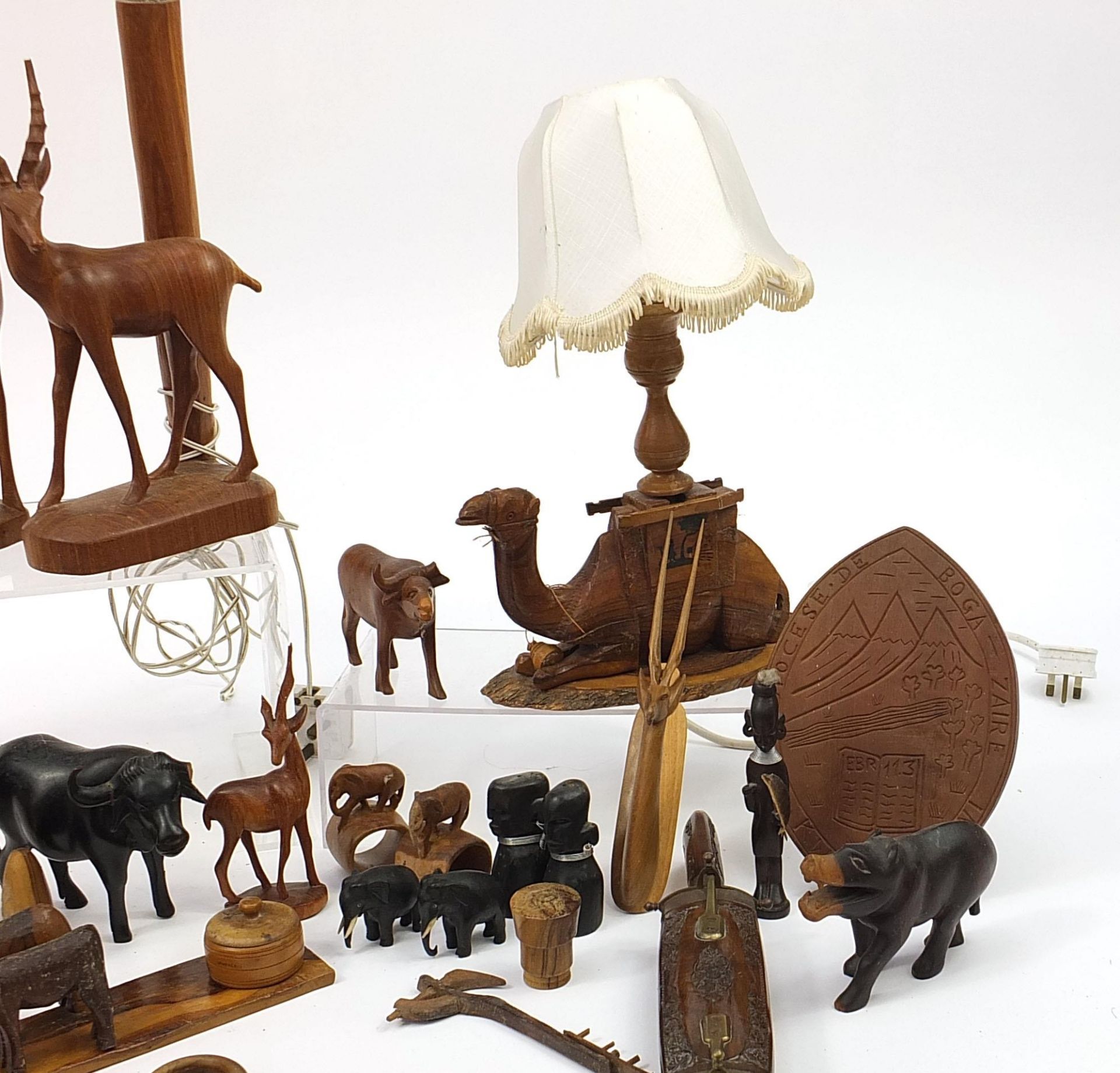 African woodenware to include carved elephants, table lamp, wall plaque, figures and a carving - Image 4 of 7
