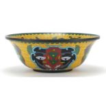 Chinese cloisonne bowl enamelled with mythical faces, 23.5cm in diameter