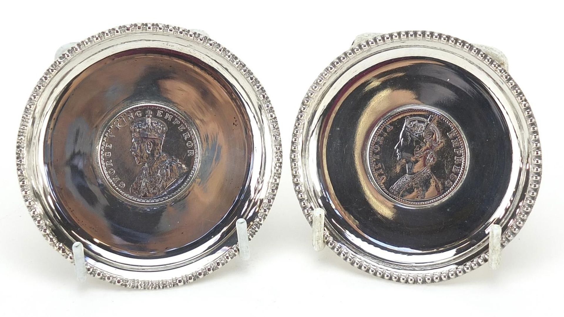 Two Indian silver one rupee coin dishes comprising 1888 and 1914, 8cm in diameter, 89.7g