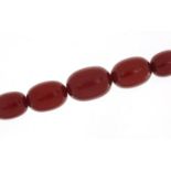 Cherry amber coloured bead necklace, 70cm in length, 85.5g