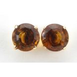 Pair of 9ct gold citrine solitaire stud earrings, 9mm in diameter, 2.8g