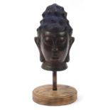 Chinese patinated bronze head of Buddha, overall 53cm high