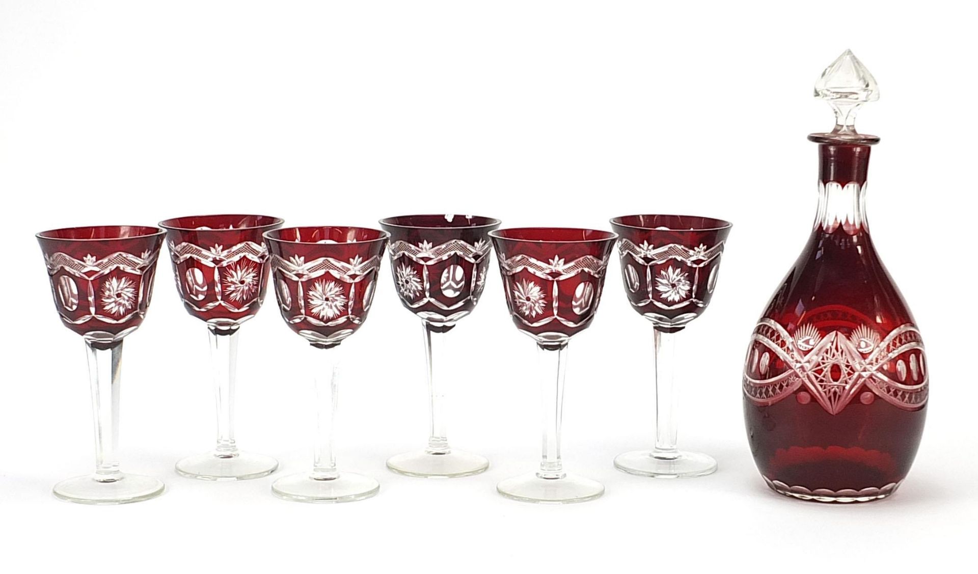 Set of six Bohemian ruby flashed cut glasses and a decanter, the largest 29.5cm high