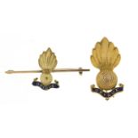 Two 9ct gold and enamel military interest Ubique grenade brooches, the largest 4.2cm wide, total 7.