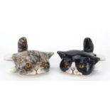 Two Winstanley pottery recumbent cats with glass eyes, 12cm in length