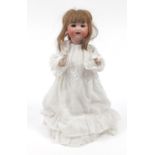 Armand Marseille bisque headed doll numbered 990 to the back of the head, 49cm in length