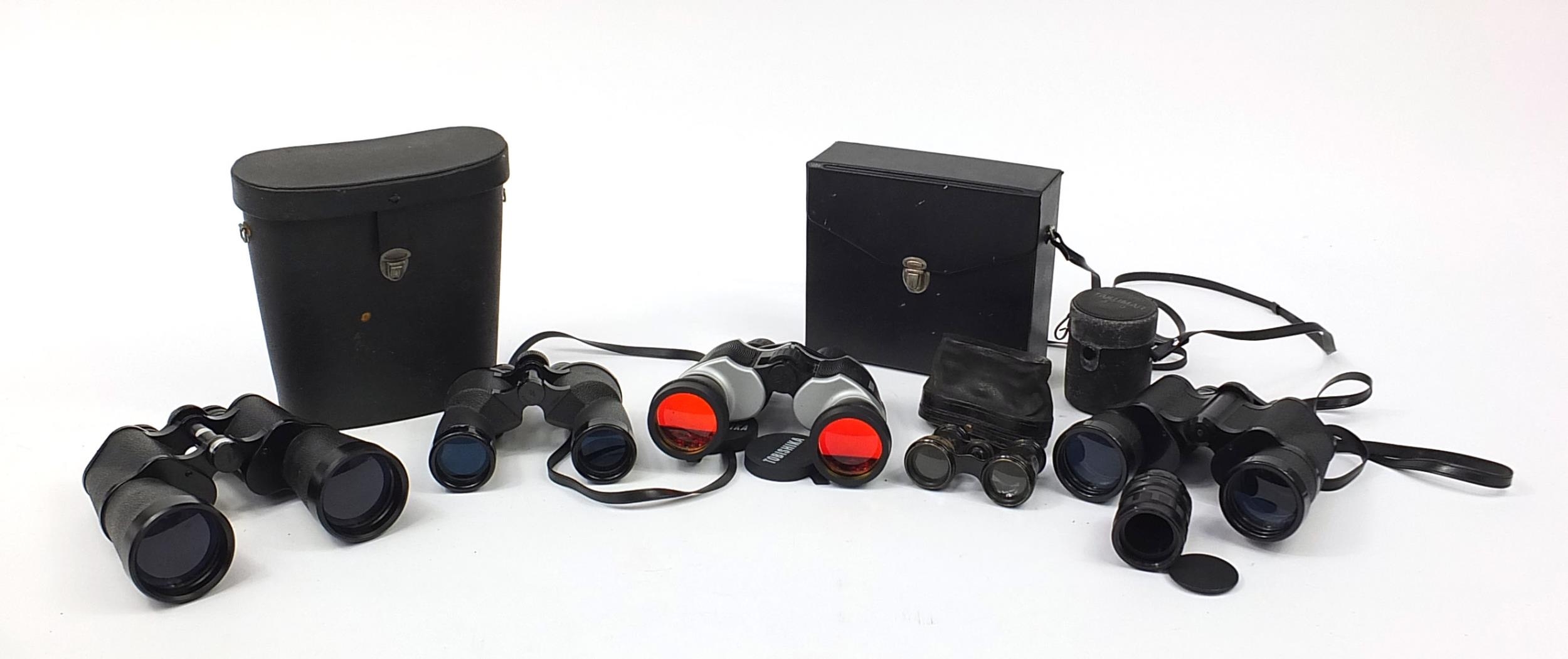 Four pairs of binoculars and a pair of opera glasses including Tobishika and Tecnar