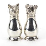 Pair of novelty silver plated casters in the form of a cat and dog, 11cm high