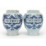 Two 18th century Delft blue and white tin glazed drug jars, 19cm high