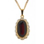 9ct gold sapphire and diamond pendant on a 9ct gold necklace, 2.5cm high and 46cm in length, total
