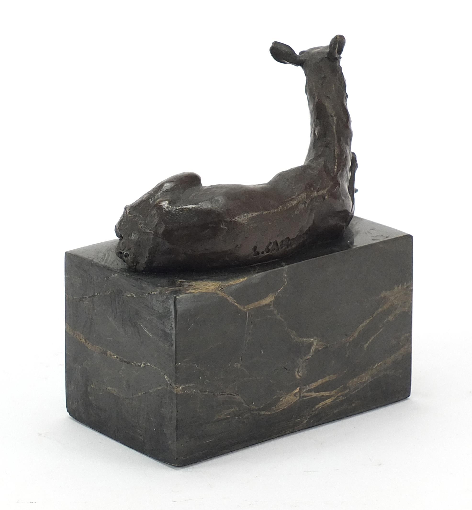 Mid century design patinated bronze sculpture of a recumbent deer raised on a black marble base, - Image 2 of 4