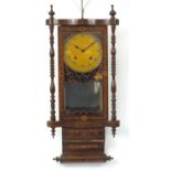 Inlaid mahogany striking wall clock with visible pendulum, 88cm high