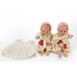 Two miniature bisque head dolls with open and close eyes, 20cm high