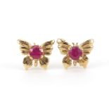 Pair of unmarked gold ruby butterfly stud earrings, 9mm wide, 1.2g