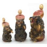 Graduated set of three Majolica style grizzly bear jugs, the largest 34cm high