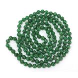 Chinese green jade bead necklace, 66cm in length