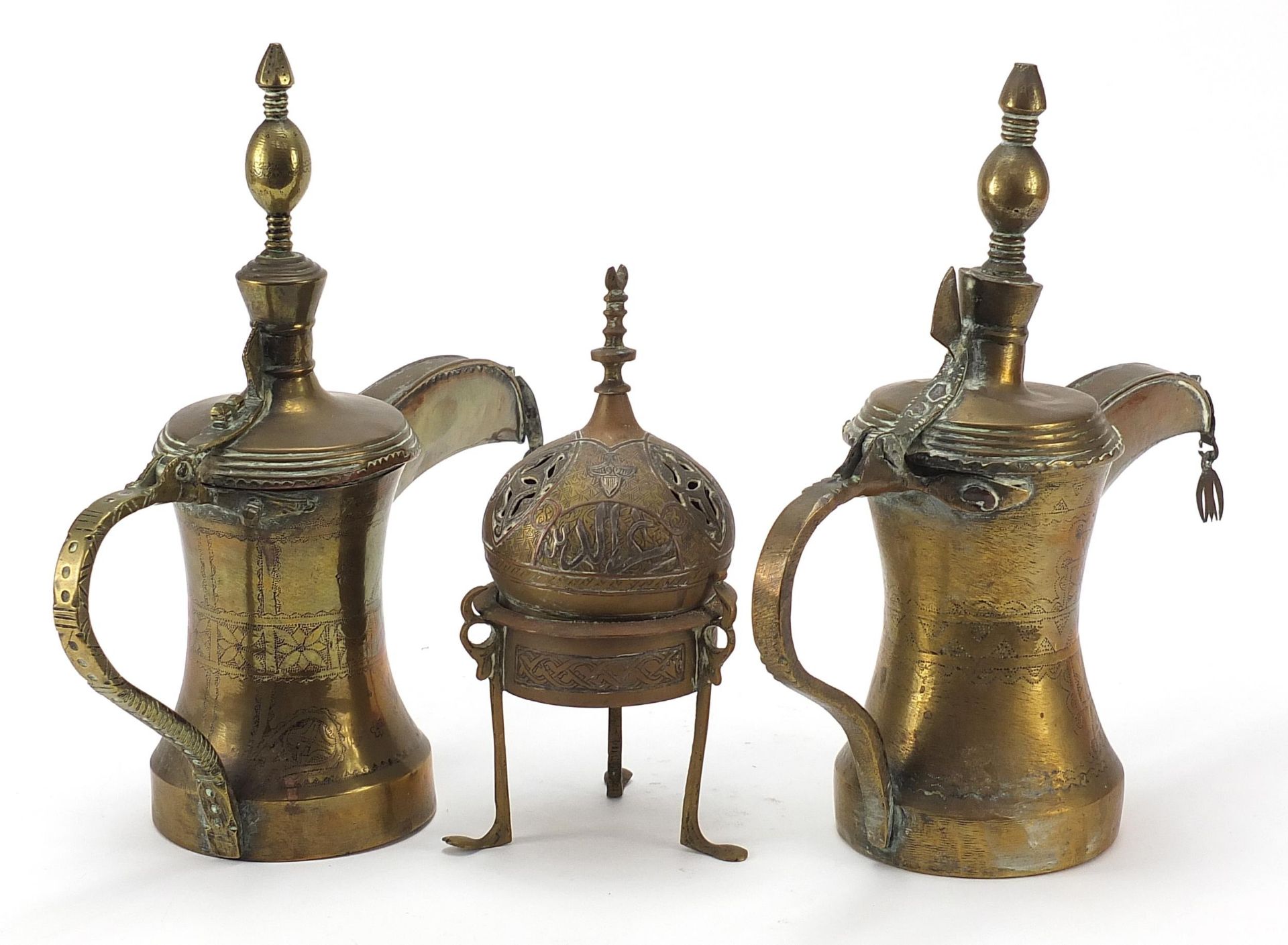 Middle Eastern metalware comprising two Omani Dallah coffee pots and a Cairoware incense burner with - Image 3 of 4