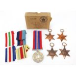 Four British military World War II medals with box of issue inscribed Mr T J Couston