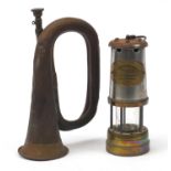 Copper bugle by A F Matthews of London dated 1949 and a British coal miner's lamp with brass plate