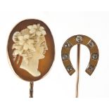 Two 9ct gold stick pins comprising cameo maiden head and horseshoe set with clear stones, the