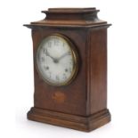 Edwardian inlaid oak mantle clock with painted dial having Arabic numerals, 34cm high