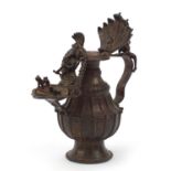 Indian patinated gilt bronze jug with Ganesh, 29cm high