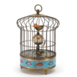 Brass and cloisonne clockwork automaton bird cage with alarm clock, 19cm high