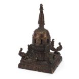 Chino Tibetan gilt patinated bronze stupa on square base, 22cm high