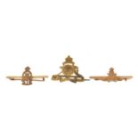 Three 9ct gold military interest brooches including Ordnance Corps, the largest 3cm wide, total 3.0g