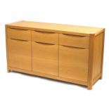 Contemporary light oak Winsor sideboard fitted with three drawers above three cupboard doors, 80.5cm