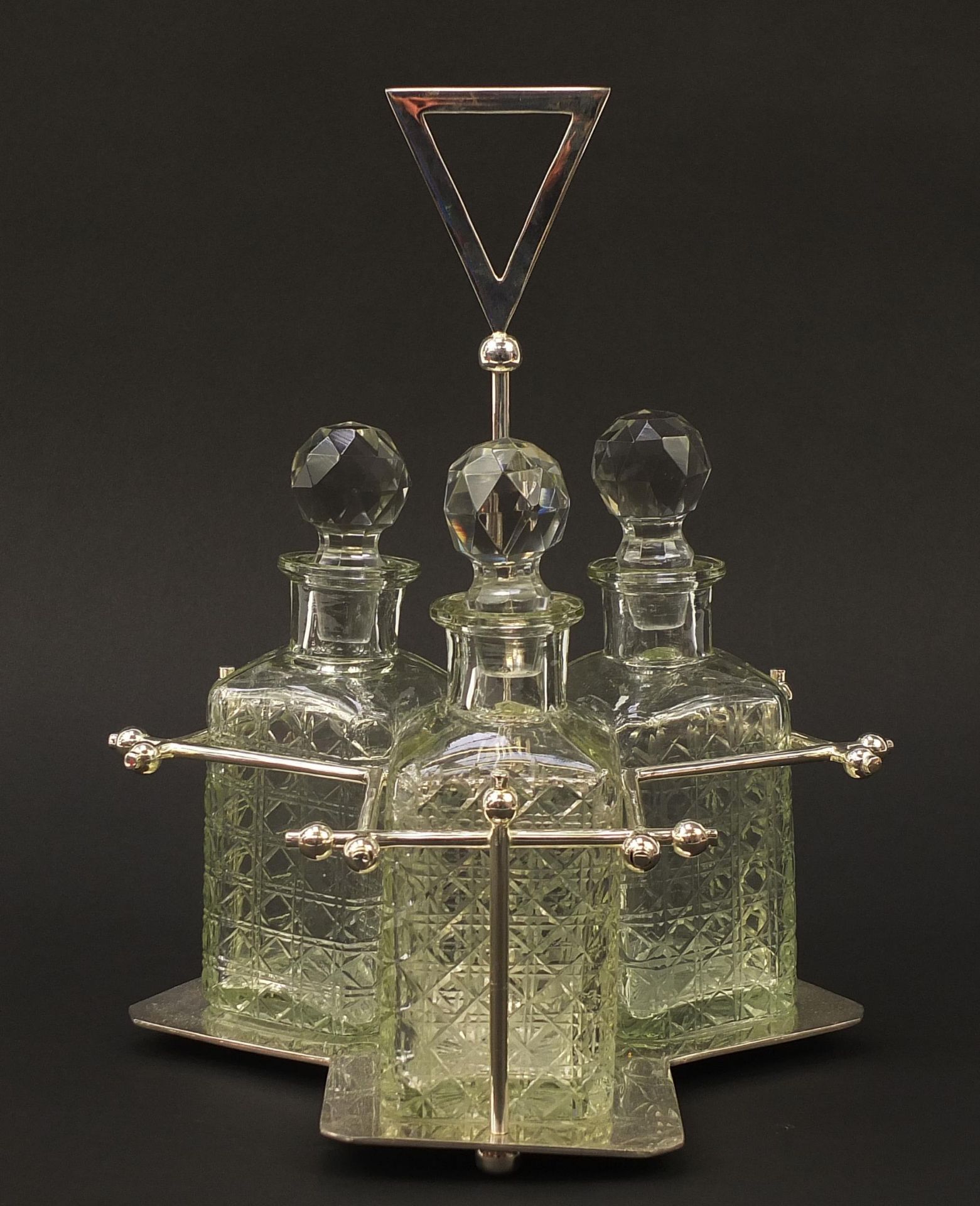 Modernist silver plated three bottle tantalus with glass decanters in the style of Christopher - Image 2 of 5