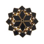 Antique gold coloured metal and black stone starburst brooch pendant, possibly black onyx or jet,