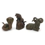 Three Japanese patinated bronze animals comprising tiger on a rock, cobra and goat, each with