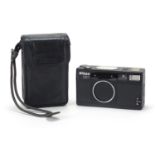 Nikon 28TI camera with an analogue display system housed in a leather carry case